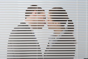 Picture of a couple cheating beind the blinds